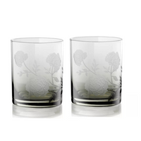 The Current Home Peony DOF Set of 2 features clear, mouth-blown glass tumblers with an etched rose and leaf design—elegant glassware perfect for any refined table setting.