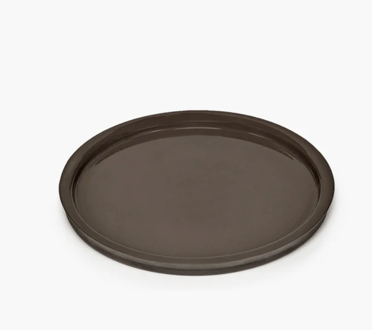 The Serax Dune Dinner Plate Slate, a round, dark brown plate with a raised edge from the Dune collection, is displayed on a plain white background.