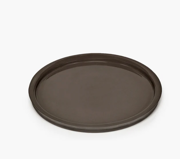 The Serax Dune Dinner Plate Slate, a round, dark brown plate with a raised edge from the Dune collection, is displayed on a plain white background.