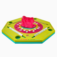 The Oh My Mahjong Mahjong Aqua Pool Mat, a bright green and yellow octagonal mat, comes with tile racks, scoreboards, and a pink drawstring bag for tiles—all neatly arranged for play.