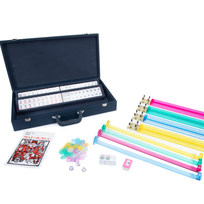 The Rowan Mahjong Set - Navy by Brouk & Co features a navy carrying case, Mahjong tiles, multicolored racks, chips, dice, a scoring booklet, and more—stylishly organized and perfect for portable play anywhere.