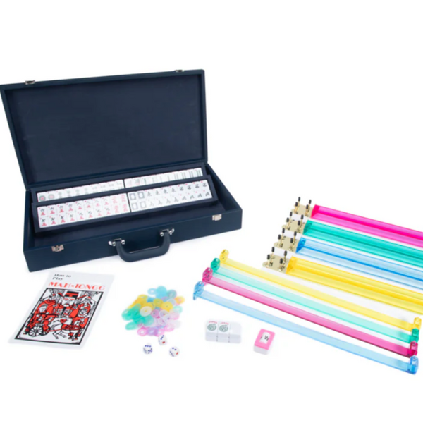 The Rowan Mahjong Set - Navy by Brouk & Co features a navy carrying case, Mahjong tiles, multicolored racks, chips, dice, a scoring booklet, and more—stylishly organized and perfect for portable play anywhere.