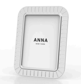 The Striations Frame Silver by Anna New York features vertical and horizontal indented lines and displays “ANNA NEW YORK” at the center, highlighting contemporary elegance and minimalist design.