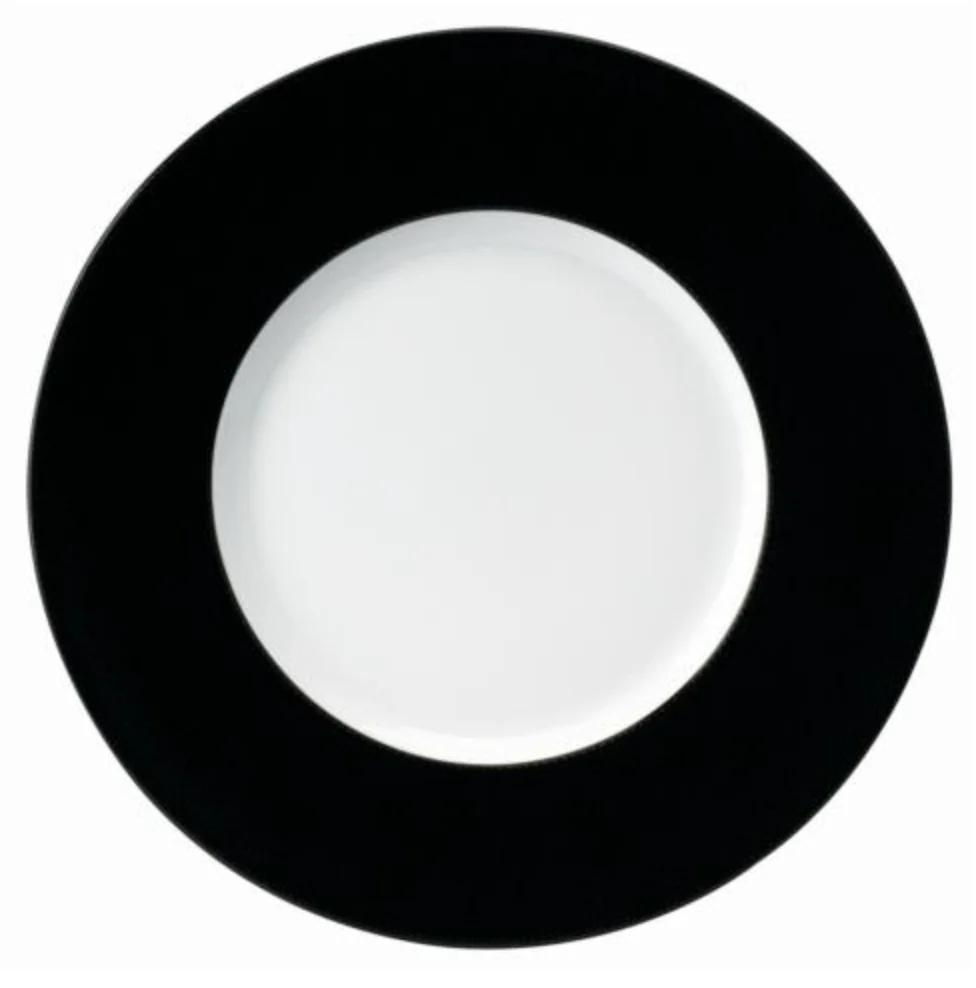 The Philippe Deshoulieres Seychelles Dinner Plate Black 11" is a Limoges porcelain round plate with a wide black rim and white center, shown from above on a plain white background.