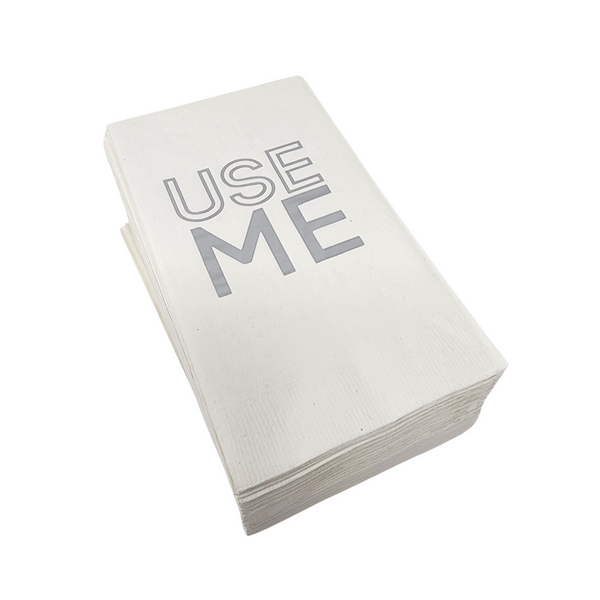 The Print Appeal Guest Hand Towel Pack – Use Me features white paper hand towels with "USE ME" printed in bold on the top, ideal for display in a guest towel holder.