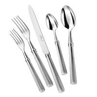 The Beatrix Flatware 5 Piece Setting by Alain Saint-Joanis includes two forks, a knife, teaspoon, and tablespoon with matching grooved handles in stainless steel, all dishwasher safe for easy cleaning.
