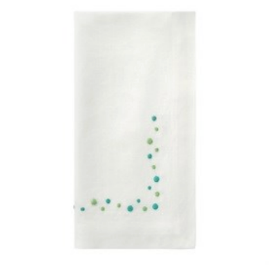 The Bodrum Dots Napkin Set of 4 - Teal features a simple embroidered L-shaped design with teal and green dots in one corner—ideal for adding an elegant touch to your dining table.