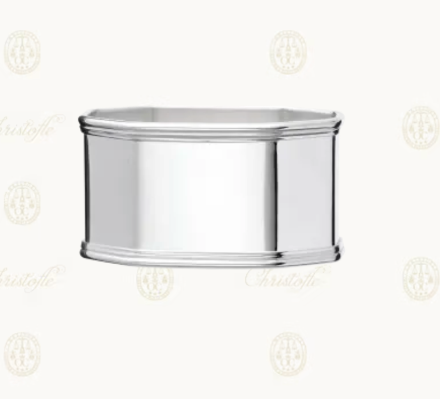 The Christofle Anne Silver-Plated Napkin Ring features smooth sides and subtly raised edges, set against a pale background with soft Christofle logos—a timeless addition to your family table accessories.