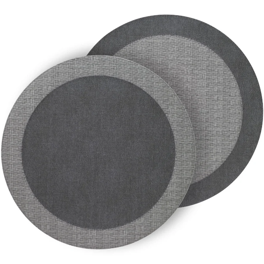 The Bodrum Halo Placemat Set of 4 - Neutrals features round placemats with a woven outer edge and solid center in dark gray, adding modern style to any table setting.