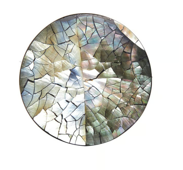 The Shell Coasters Set of 4 - Black Pearl by Von Gern Home features round mosaic coasters crafted from iridescent shell pieces in silver, green, and gray—perfect as stylish drink coasters or eye-catching decor for any setting.