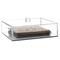 The BT-Shalom Lucite Matzah Box With Lid features a clear, rectangular design with an acrylic handle—an elegant way to display matzo crackers and enhance your table decor.