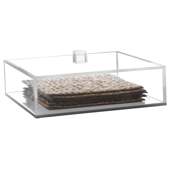 The BT-Shalom Lucite Matzah Box With Lid features a clear, rectangular design with an acrylic handle—an elegant way to display matzo crackers and enhance your table decor.