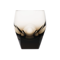 The Moser Bar Spirit Tumbler Shot Glass 45ml features a modern faceted design with a smoky gradient from clear to dark, making it an elegant addition to any bar or the perfect match for cut-crystal glasses.