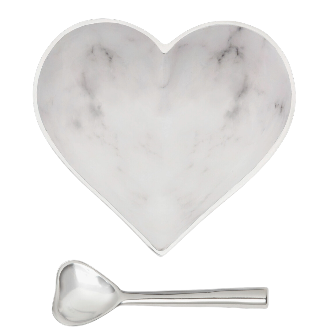 The Inspired Generations Happy Heart Bowl With Spoon in White Marble features a heart-shaped marble-patterned bowl paired with a handcrafted aluminum heart spoon, both displayed elegantly on a white background.