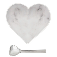 The Inspired Generations Happy Heart Bowl With Spoon in White Marble features a heart-shaped marble-patterned bowl paired with a handcrafted aluminum heart spoon, both displayed elegantly on a white background.