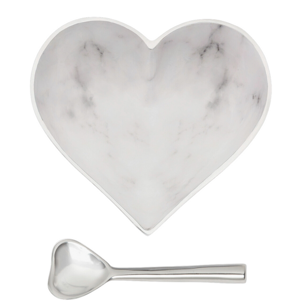 The Inspired Generations Happy Heart Bowl With Spoon in White Marble features a heart-shaped marble-patterned bowl paired with a handcrafted aluminum heart spoon, both displayed elegantly on a white background.