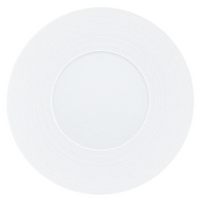 A JL Coquet Hemisphere Dinnerware Satin White plate, viewed from above, features a subtle circular textured pattern engraved on its porcelain rim.