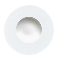 The JL Coquet Hemisphere Dinnerware Satin White is a round ceramic plate with a wide, textured rim and shallow center, showcasing minimalist engraved porcelain design from the Hemisphere collection on a white background.