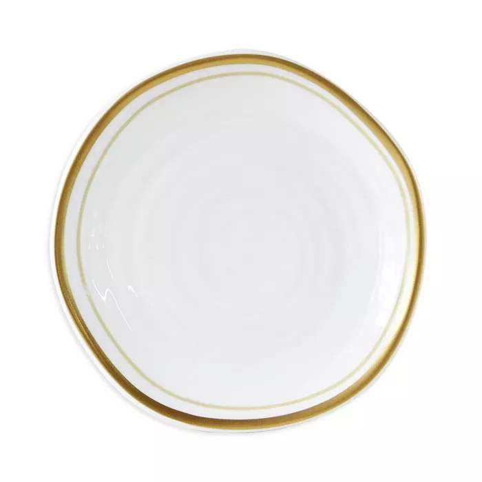 The Albatre Dinnerware - Gold by Bernardaud is a white ceramic plate with a subtly irregular shape and an elegant gold rim—perfect for enhancing any gold-rim plates or alabaster dinnerware collection.