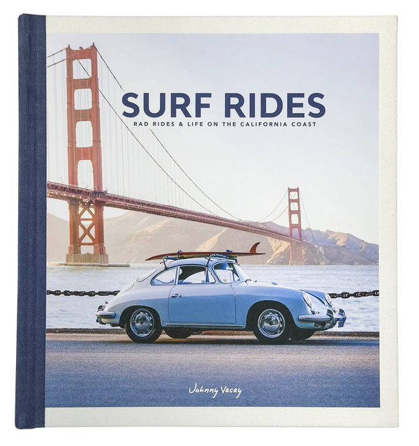 The Surf Rides book cover by Johnny Vacay features a vintage blue car with a surfboard and durable surf gear, parked before the Golden Gate Bridge.