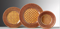 Three NEW! Patagonia Yellow Melamine Dinnerware plates by Mario Luca Giusti, made in Italy, feature geometric patterns in warm yellow, orange, and brown tones, displayed against a gradient gray and white background.