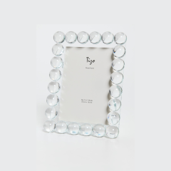 The Tizo Crystal Ball Frame, with a rectangular shape and clear, round glass bead border, sparkles against a light gray background—an elegant decor piece ready for your personalized display.