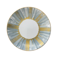 The Marie Daage Panache by Marie Daâge is a round hand-painted porcelain plate featuring a white center, alternating gold and light blue brushstroke patterns, and a gold rim—adding a touch of luxury to any table setting.