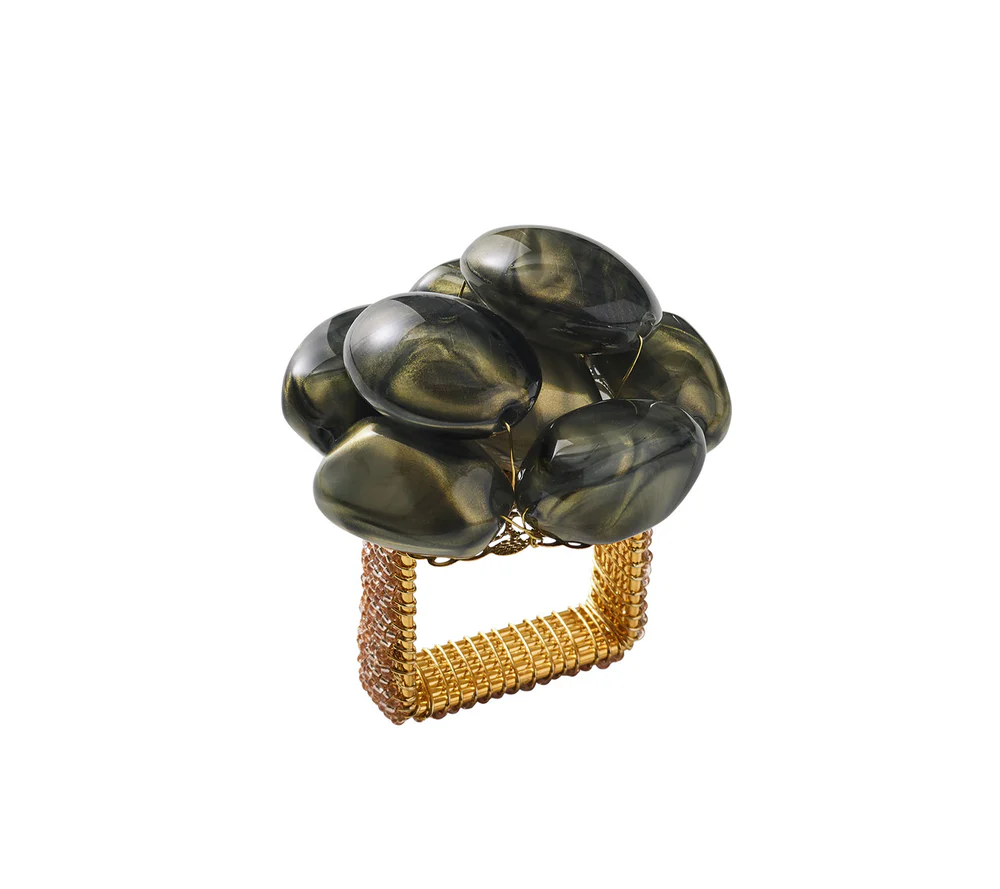The Kim Seybert Bonton Napkin Ring Set of 4 - Grey & Gold features a gold mesh band topped with smooth, dark green marbleized beads, shown against a white background.