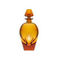 The Moser Bar Decanter 750 ml features a geometric amber glass design with a matching stopper and elegant curves, reminiscent of luxury exclusive Bar collections, all set against a white background.