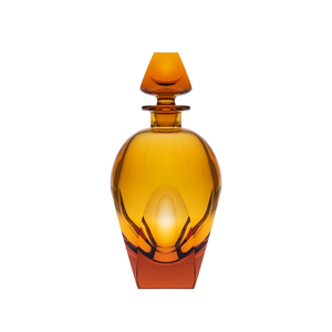 The Moser Bar Decanter 750 ml features a geometric amber glass design with a matching stopper and elegant curves, reminiscent of luxury exclusive Bar collections, all set against a white background.