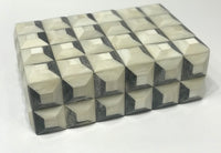 The Bojay Checkmate Box Grey Small is a compact storage box with a 3D geometric cube pattern in white, gray, and black, creating an optical illusion and standing out against its plain white background.