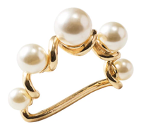The Kim Seybert Pearl Drift Napkin Ring Set of 4 features white pearls of varied sizes on a twisted gold band, creating an abstract, modern look—ideal for adding elegance to any table setting.