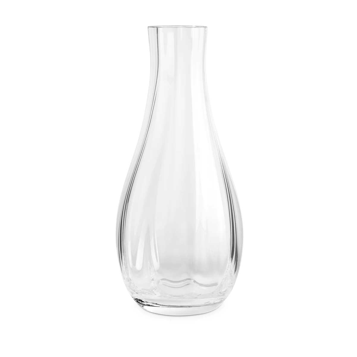 The Iris Drinkware Collection by L'Objet features a clear glass decanter with a wide, rounded base and a narrow, flared neck, displayed against a plain white background.