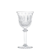 The Saint-Louis Tommy Stemware, featuring a decorative bowl, long stem, and fluted base in intricately cut crystal, is displayed against a plain white background.
