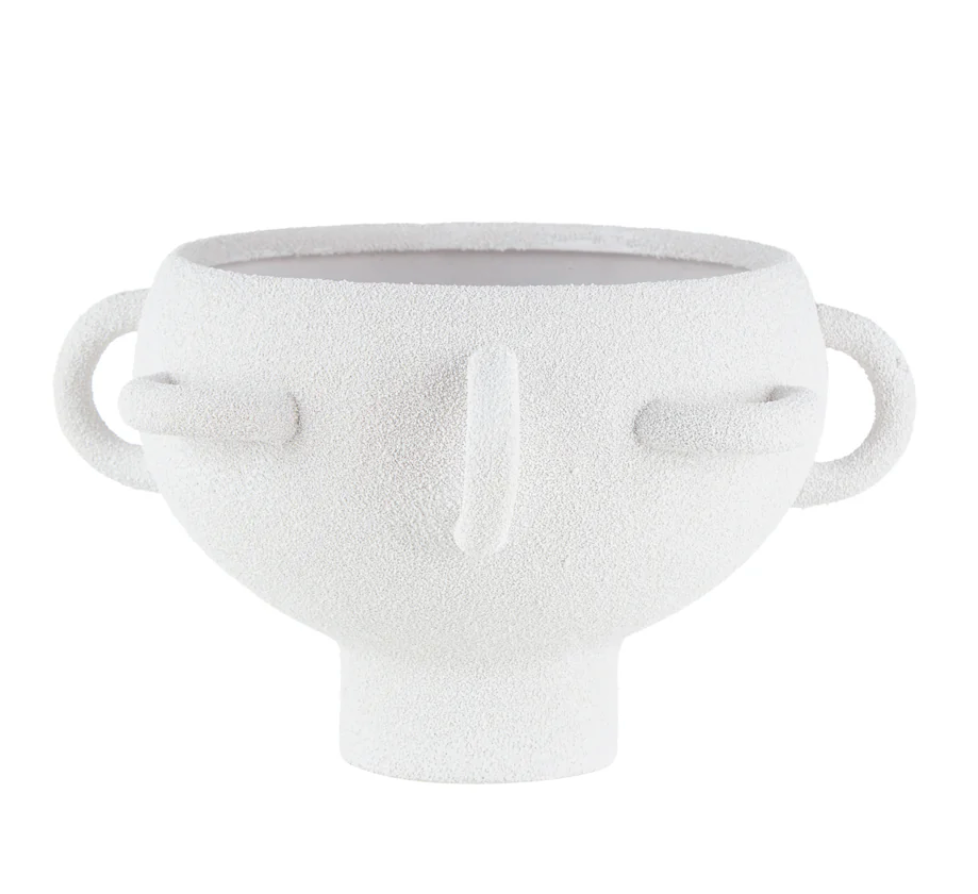 The BT-Shalom Textured Vessel White is a white porcelain piece with abstract facial features, multiple handles, and a short cylindrical base.