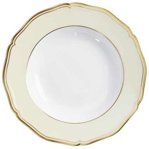 The Mazurka Gold & Ivory plate by Raynaud features white Limoges porcelain with a wide cream rim, scalloped edges, and a thin gold trim—an elegant showcase of French craftsmanship.
