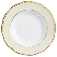 The Mazurka Gold & Ivory plate by Raynaud features white Limoges porcelain with a wide cream rim, scalloped edges, and a thin gold trim—an elegant showcase of French craftsmanship.