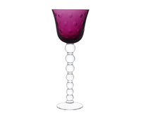 The Saint-Louis Bubbles Hock Stemware features a purple, dimpled bowl with a clear, bubble-like stem and round base, showcasing the sophisticated elegance of contemporary Saint-Louis crystal.