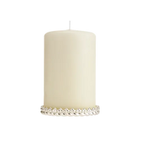The Babylone Silver Plated Candle Holder by Christofle features a sleek silver band, echoing luxury and sophistication—ideal for elevating your home decor.