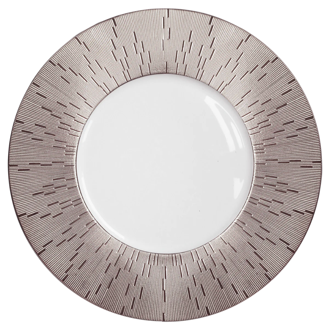 The Infini Prestige Platinum Dinnerware by Haviland is a round white Limoges porcelain plate with a wide platinum border featuring thin radiating lines in a modern, geometric design.
