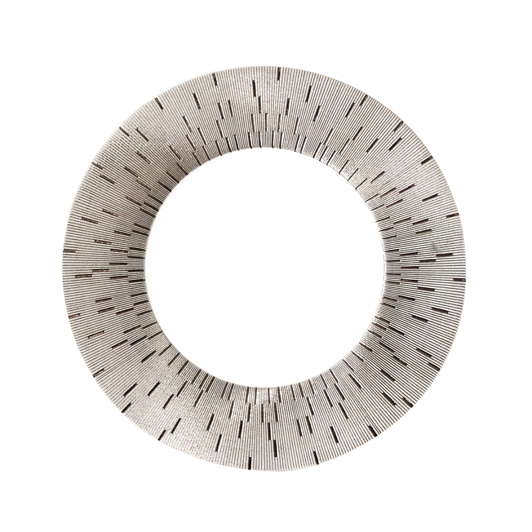 A round mirror with a wide, textured frame of radiating black lines on light recalls the artistry of Haviland’s Infini Prestige Platinum Dinnerware, inspired by hand-painted plates from the renowned Limoges porcelain collection.