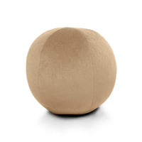 The Posh Round Pillow 12″D from D.V. KAP / Canaan Company features sculptural softness and a smooth, velvety texture in beige—an ideal accent piece for any space.