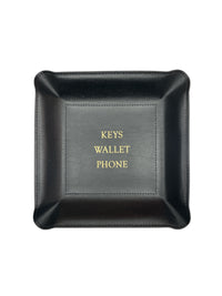 The Graphic Image Leather Valet Tray - If I Were Keys... is a black handmade leather tray with raised edges and gold embossed "KEYS WALLET PHONE" text, serving as a stylish travel organizer for your essentials.