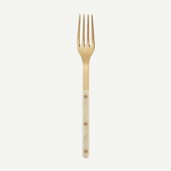 A Sabre Bistro Horn Serving Fork, made in France, features a gold stainless steel head and an off-white handle with three brass rivets, shown on a plain white background.