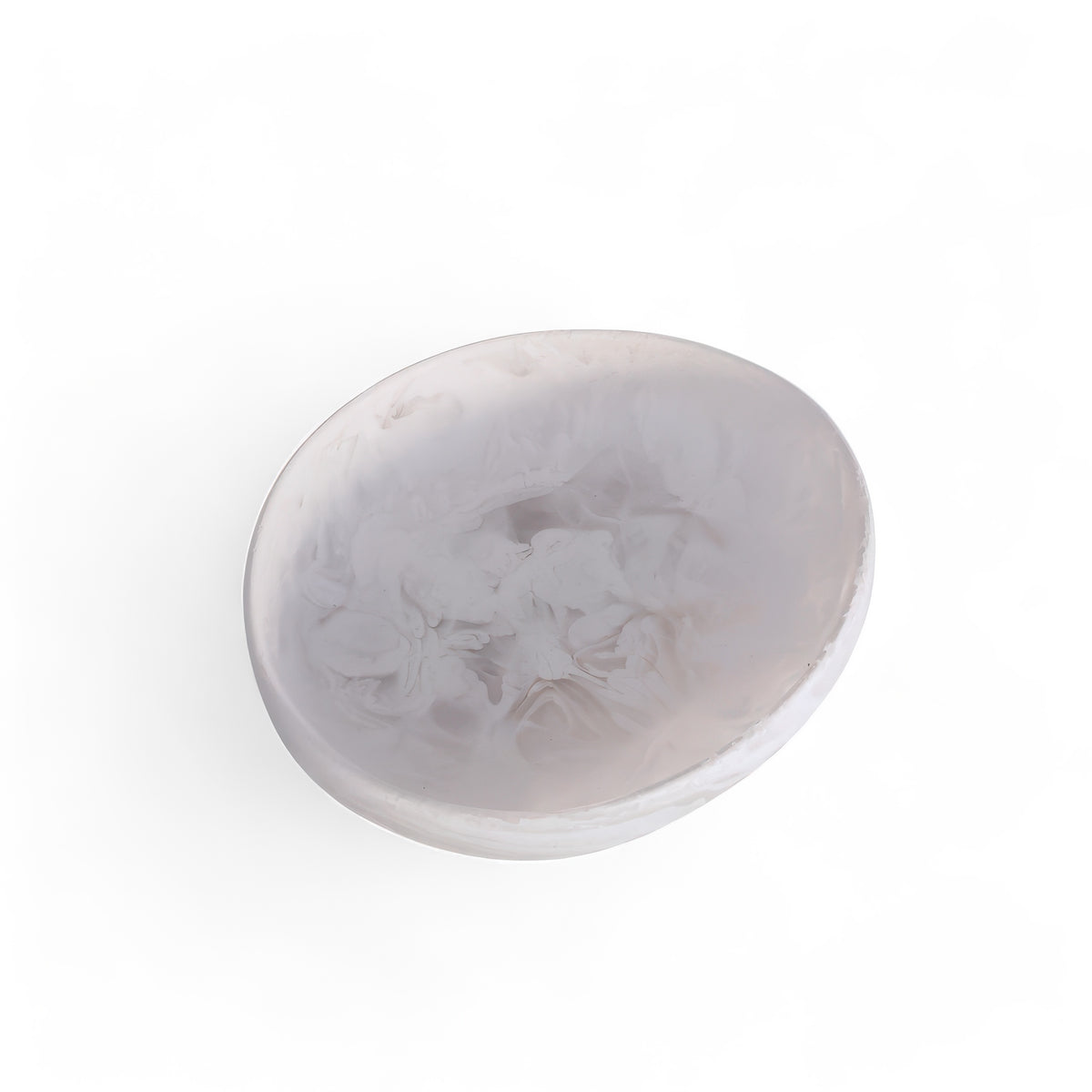 The Arila Small Bowl - White Swirl by Nashi Home features a translucent, round design with a white swirl marbled pattern—perfect for coastal décor. Photographed on a white background.