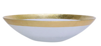 The Vietri Rufolo Glass Dinnerware Gold is a shallow, round white bowl with a smooth surface and gold metallic rim, evoking Italian style and perfect for glamorous tableware settings. Styled like the Rufolo Glass Charger on a plain white background.