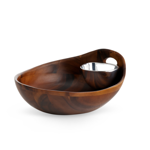 The Nambe Portables Chip & Dip features a polished acacia wood serving bowl with an attached Nambé Alloy dip bowl at the rim, ideal for snacks and dips, displayed against a white background.