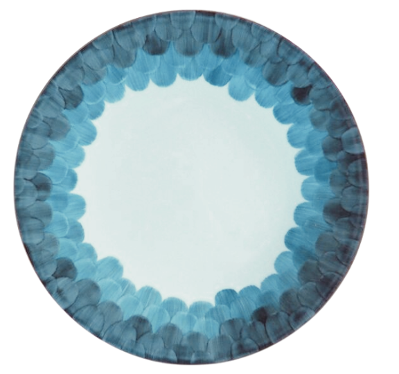 The Marie Daâge Cercle D’Ecailles Platinum Filet plate features a round ceramic design with a white center, accented by layered blue brushstroke patterns forming a circular border along the edge.