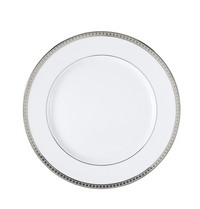A white Bernardaud Athena Platinum Dinnerware porcelain dinner plate with a silver geometric rim is shown from above on a plain white background.