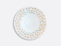 The Bernardaud Fèerie By Michael Cailloux white ceramic plate features gold, blue, and purple starburst designs around the rim and is photographed against a plain white background.